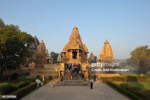 Tourist sightseeing the Lakshmana Temple, one of the Khajuraho group of monuments, a part of UNESCO World Heritage Sites at Khajuraho.
