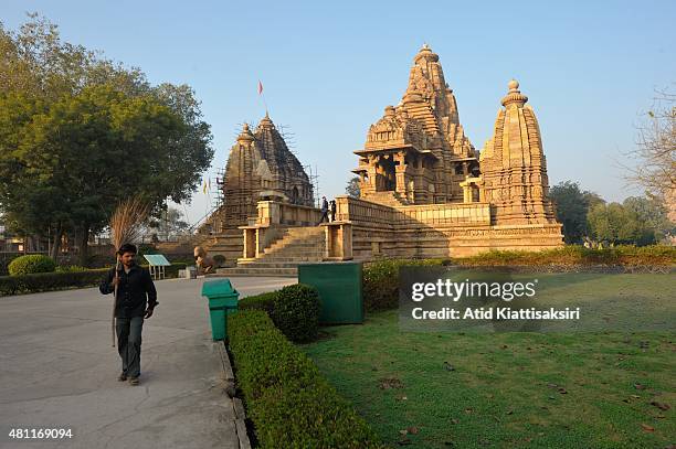 An Indian man works at Lakshmana Temple, one of the Khajuraho group of monuments, a part of UNESCO World Heritage Sites at Khajuraho.