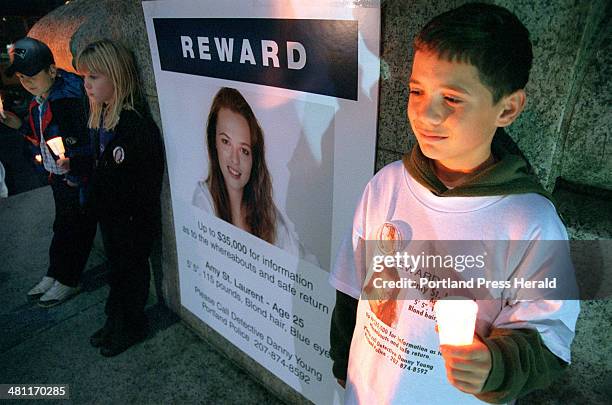 Staff Photo by David MacDonald, Fri, Oct 26, 2001: Max Green of South Portland, fights back tears during a candlelight vigil for Amy St. Laurent in...
