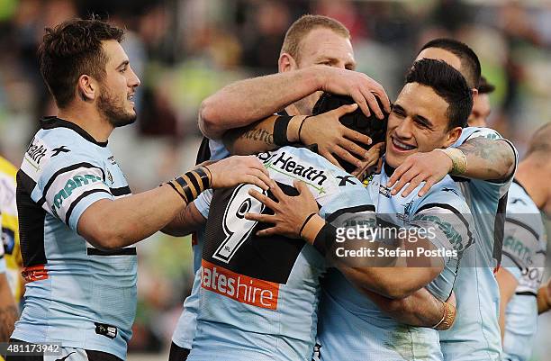 Sharks players celebrate during the round 19 NRL match between the Canberra Raiders and the Cronulla Sharks at GIO Stadium on July 18, 2015 in...