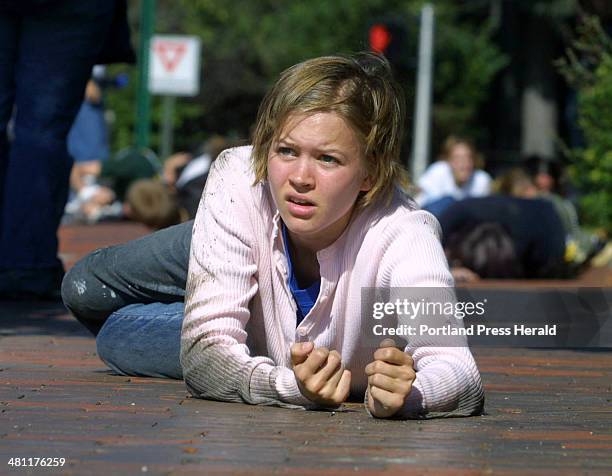 Staff Photo by Herb Swanson, Sat, Oct 05, 2002: Larissa Mellor takes part in one of contemporary artist William Pope.L crawls along a Portland...