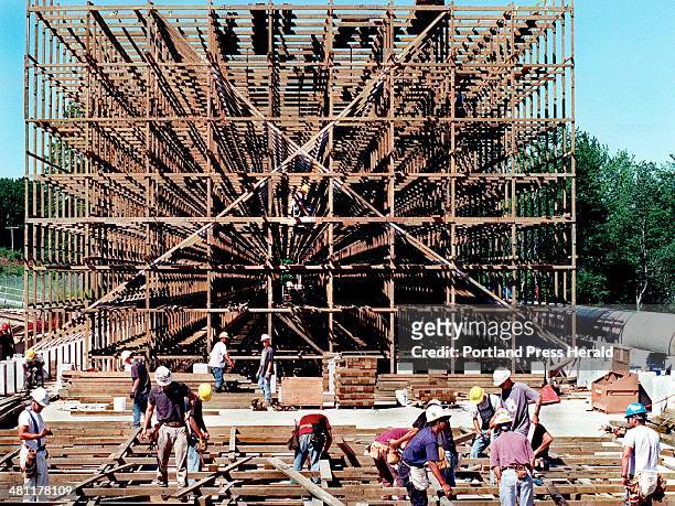 Staff Photo by Gordon Chibroski, Saturday, July 8, 2000: This cooling tower being built of pressure treated lumber will cool all of the water coming...