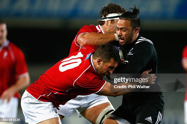 Matt Proctor of the Maori All Blacks is tackled by Tom Taylor of the Barbarians during the match between the New Zealand Maori All Blacks and the New...