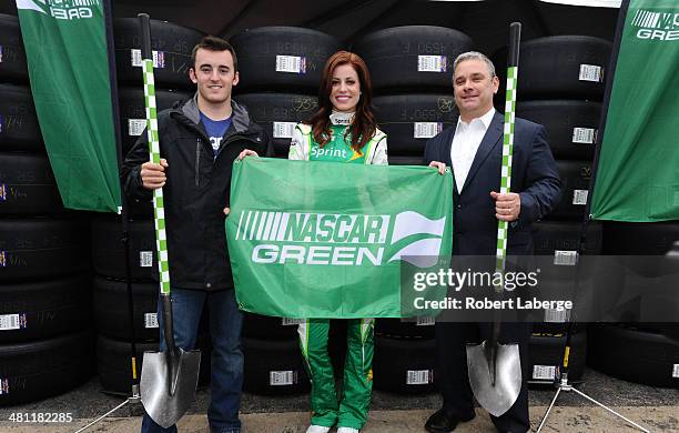 Austin Dillon, driver of the Dow Chevrolet, Miss Sprint Cup Madison Martin and Dr. Michael Lynch, NASCAR vice president of green innovation, pose for...