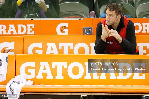 Dejected Travis Cloke of the Magpies sits on the bench at 3/4 time with an injury during the round 16 AFL match between the Collingwood Magpies and...