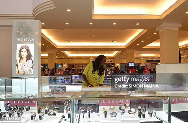 Saleswoman is pictured in the Westgate shopping mall, after it reopened on July 18, 2015 in Nairobi. Kenya's Westgate shopping mall reopened for...