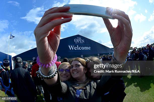 Spectators take a selfie as they queue at one of the course entrances during the second round of the 144th Open Championship at The Old Course on...