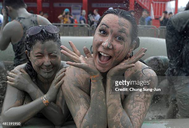 Festival-goers enjoy the mud during the annual Boryeong Mud Festival at Daecheon Beach on July 18, 2015 in Boryeong, South Korea. The mud, which is...