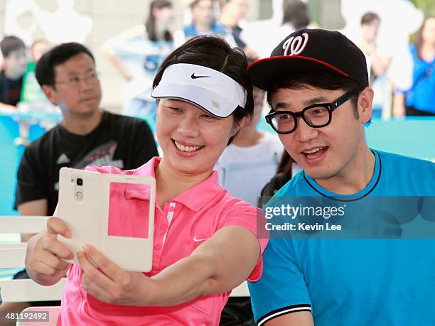 Olympic gold medallist Sun Tiantian and Chinese pop senstion Wang Zhengliang take a selfie at an Australian Open 2016 event July 19, 2015 in...