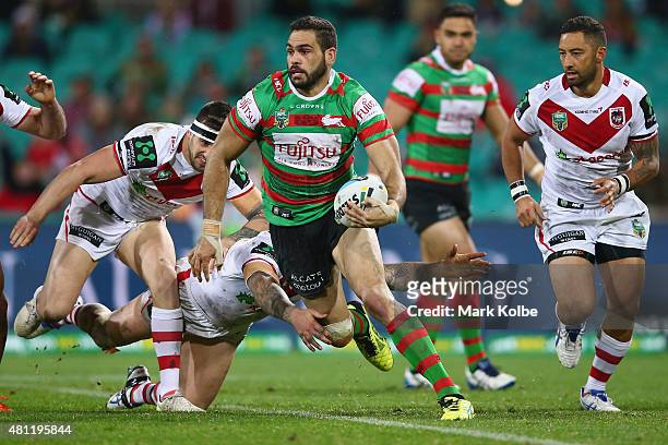 Greg Inglis of the Rabbitohs breaks away from the Dragons defence during the round 19 NRL match between the St George Illawarra Dragons and the South...