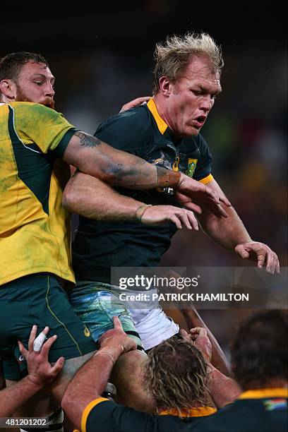 Schalk Burger of South Africa is tackled during the Rugby Championship Test match between Australia and South Africa at Suncorp Stadium, Brisbane on...