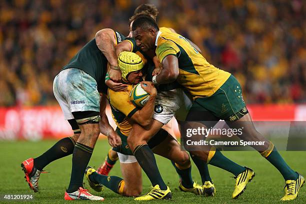 Matt Giteau of the Wallabies is tackled during The Rugby Championship match between the Australian Wallabies and the South Africa Springboks at...