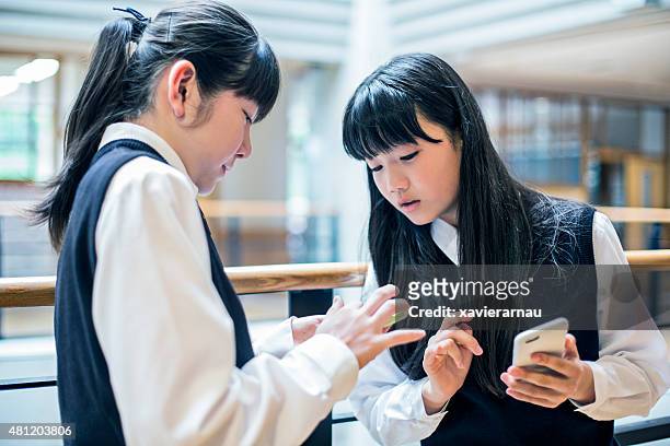 sharing mobile phone information - japan 12 years girl stock pictures, royalty-free photos & images