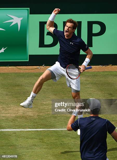 Andy Murray of Great Britain celebrates winning second set tie break with Jamie Murray of Great Britian against Nicolas Mahut and Jo-Wilfried Tsonga...