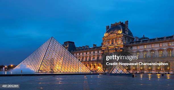 Louvre Museum with the famous Pyramids at dusk, Paris, France