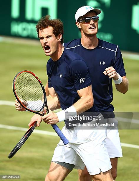 Andy Murray of Great Britain celebrates winning second set tie break with Jamie Murray of Great Britian against Nicolas Mahut and Jo-Wilfried Tsonga...