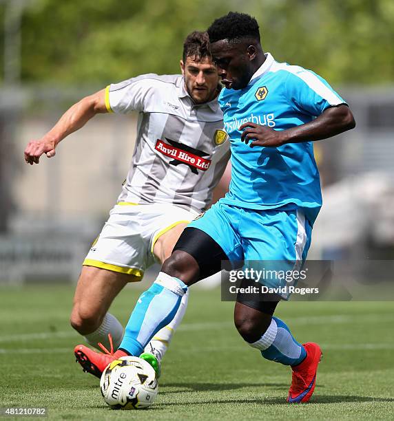 Nouha Dicko of Wolves moves away from John Mousinho during the pre season friendly match between Burton Albion and Wolverhampton Wanderers at the...