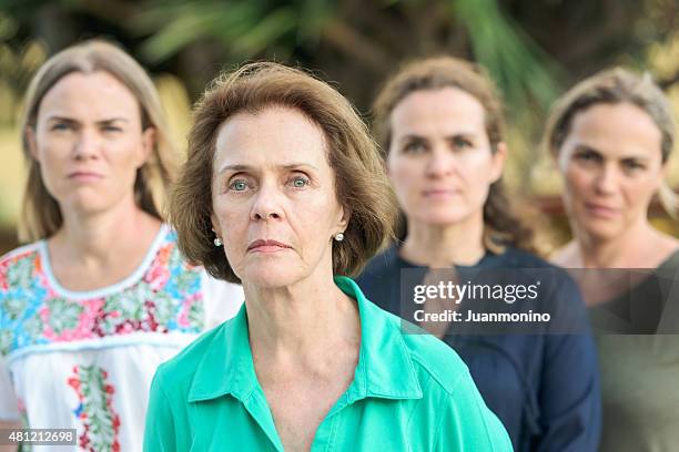 senior mother and daughters - family serious stock pictures, royalty-free photos & images