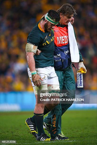 Marcell Coetzee of South Africa is assisted from the field during the Rugby Championship Test match between Australia and South Africa at Suncorp...