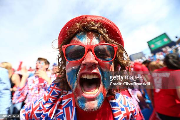 Fans celebrate the win between Jamie Murray and Andy Murray of Great Britain against Nicolas Mahut and Jo-Wilfried Tsonga of France during Day Two of...