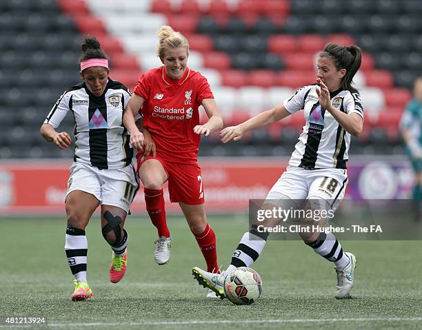 Kate Longhurst of Liverpool Ladies FC is tackled by Desiree Scott and Leanne Crichton of Notts County Ladies FC during the FA WSL 1 match between...