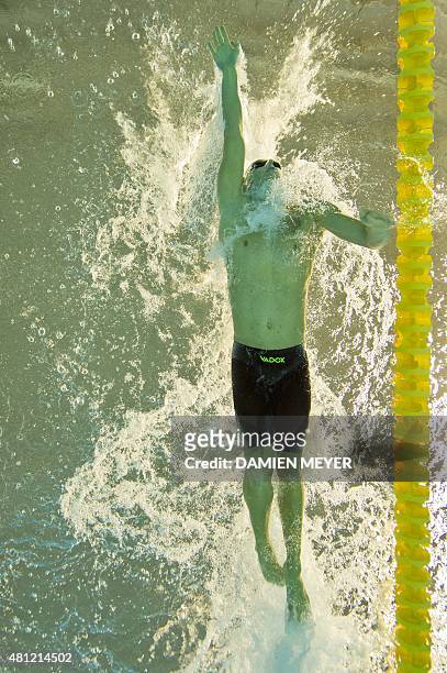 This picture taken with an underwater camera shows Henrique Rodriguez of Brazil competing in the men's 200m individual medley preliminary at the Pan...