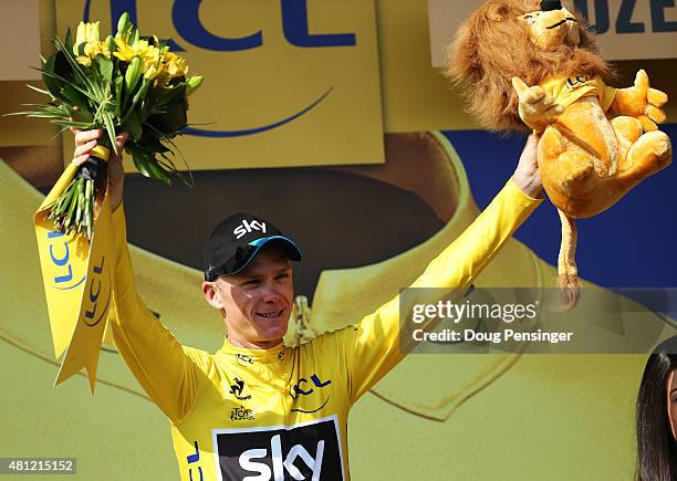 Chris Froome of Great Britain and Team Sky celebrates after retaining the overall leader's yellow jersey at the end of stage 14 during the 2014 Tour...