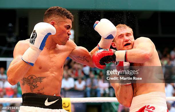 Ruslan Schelev of Ukraine exchange punches with Anthony Ogogo of Great Britain during the middleweight fight at Gerry Weber Stadium on July 18, 2015...