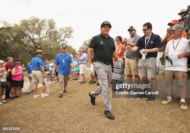 Phil Mickelson finishes at the 1st during Round Two of the Valero Texas Open at TPC San Antonio AT&T Oak Course on March 28, 2014 in San Antonio,...