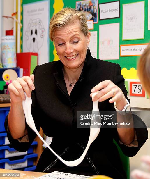 Sophie, Countess of Wessex plays with some 'Cloud Dough' as she visits the Queensgate Foundation Primary School during a day of engagements on the...