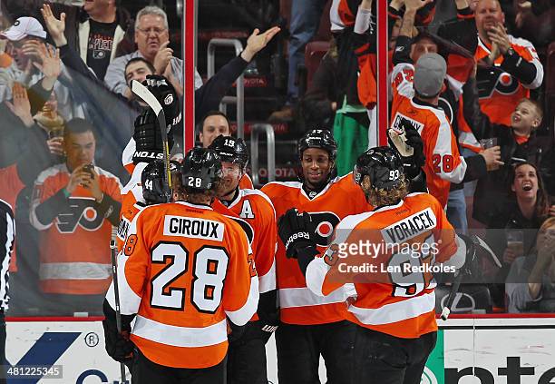 Claude Giroux, Kimmo Timonen, Scott Hartnell, Wayne Simmonds and Jakub Voracek of the Philadelphia Flyers celebrate Hartnell's second period...