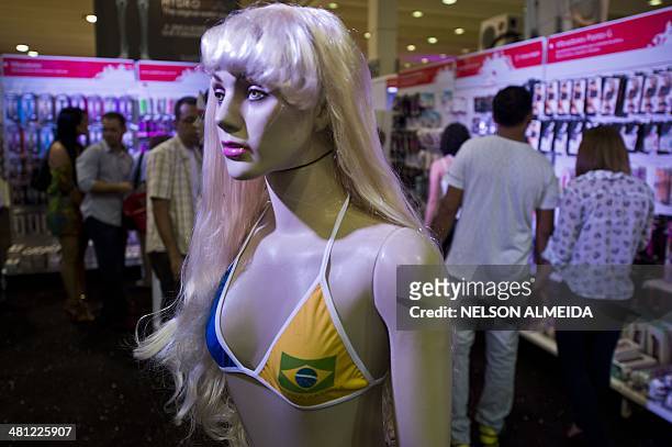 Visitors look at products in a stand during the Erotika Fair in Sao Paulo, Brazil, on March 28, 2014. The event, the biggest of its kind in Latin...