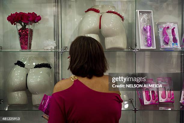 Visitor looks at products in a stand during the Erotika Fair in Sao Paulo, Brazil, on March 28, 2014. The event, the biggest of its kind in Latin...