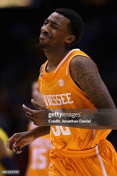 Jordan McRae of the Tennessee Volunteers reacts after missing the final shot to be defeated by the Michigan Wolverines 73 to 71 during the regional...