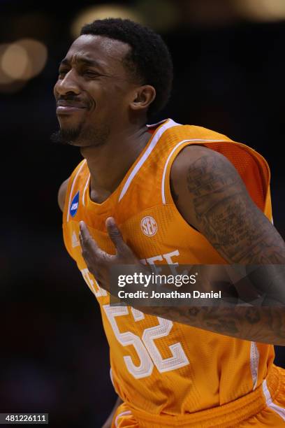 Jordan McRae of the Tennessee Volunteers reacts after missing the final shot of the game to be defeated by the Michigan Wolverines 73 to 71 during...