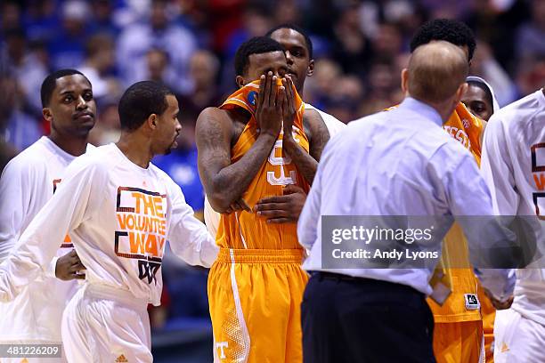 Jordan McRae of the Tennessee Volunteers reacts after missing the final shot of the game to be defeated by the Michigan Wolverines 73 to 71 during...