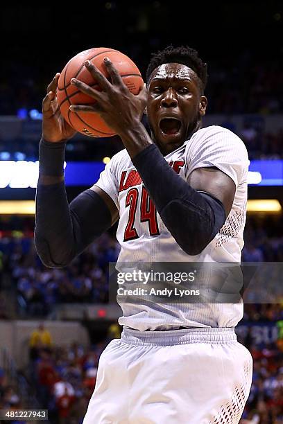 Montrezl Harrell of the Louisville Cardinals rebounds the ball against the Kentucky Wildcats during the regional semifinal of the 2014 NCAA Men's...