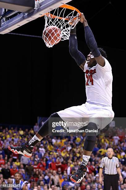 Montrezl Harrell of the Louisville Cardinals dunks the ball in the first half against the Kentucky Wildcats during the regional semifinal of the 2014...