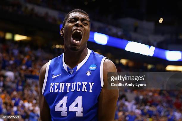 Dakari Johnson of the Kentucky Wildcats celebrates after making a basket in the first half against the Louisville Cardinals during the regional...