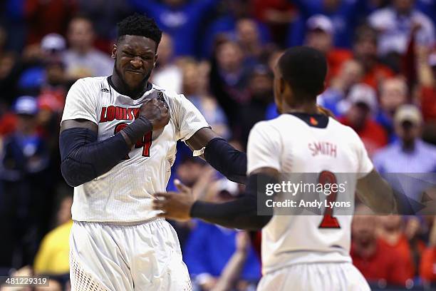 Montrezl Harrell of the Louisville Cardinals celebrates with teammate Russ Smith after a basket against the Kentucky Wildcats during the regional...