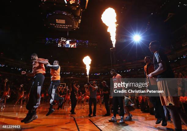 Eric Bledsoe of the Phoenix Suns leaps in the air as he is introduced to the NBA game against the New York Knicks at US Airways Center on March 28,...