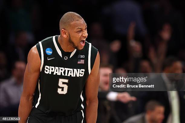 Adreian Payne of the Michigan State Spartans reacts after hitting a three pointer late in the game against Virginia Cavaliers during the regional...