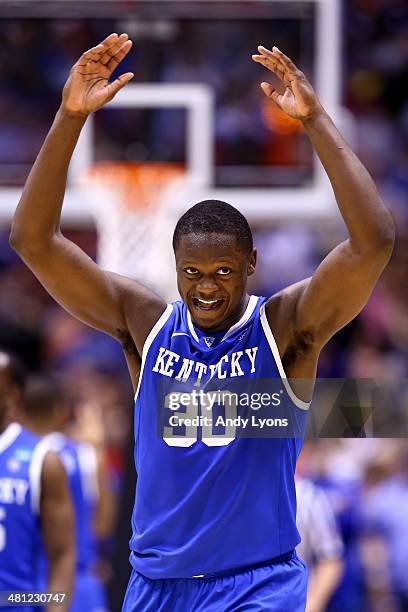 Julius Randle of the Kentucky Wildcats celebrates defeating the Louisville Cardinals 74 to 69 during the regional semifinal of the 2014 NCAA Men's...