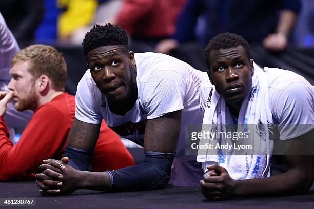 Montrezl Harrell and Mangok Mathiang of the Louisville Cardinals look on late in the second half against the Kentucky Wildcats during the regional...