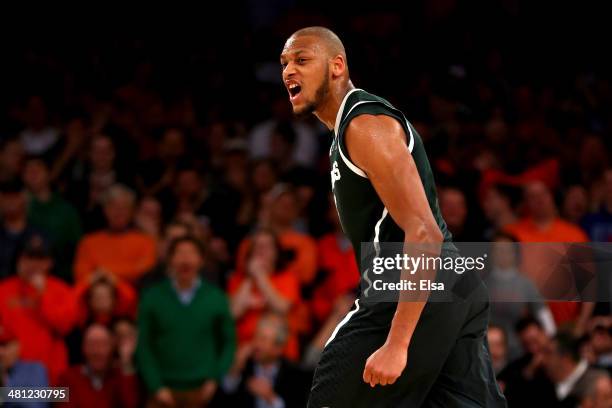 Adreian Payne of the Michigan State Spartans reacts after hitting a three pointer late in the game against Virginia Cavaliers during the regional...