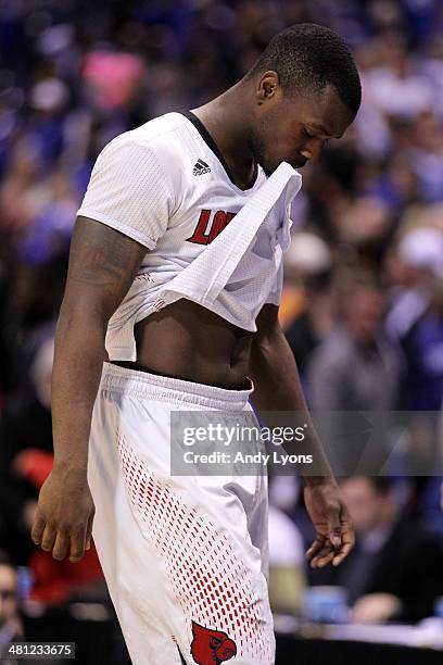 Chris Jones of the Louisville Cardinals walks off the court after being defeated by the Kentucky Wildcats during the regional semifinal of the 2014...