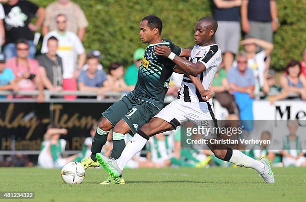 July 18: Raffael of Borussia Moenchengladbach and Yacouba Sylla of Stade Rennes battle for the ball during the friendly match between Stade Rennes...