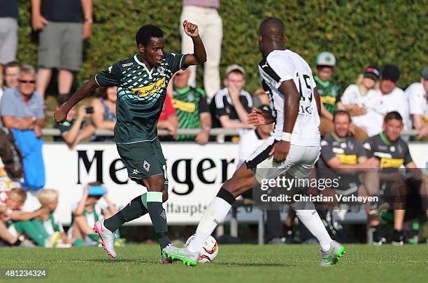 July 18: Ibrahima Traore of Borussia Moenchengladbach and Yacouba Sylla of Stade Rennes battle for the ball during the friendly match between Stade...