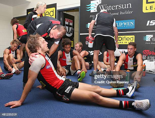 Josh Saunders of the Saints is congratulated by Aaron Hamill after winning the round two AFL match between the St Kilda Saints and the Greater...