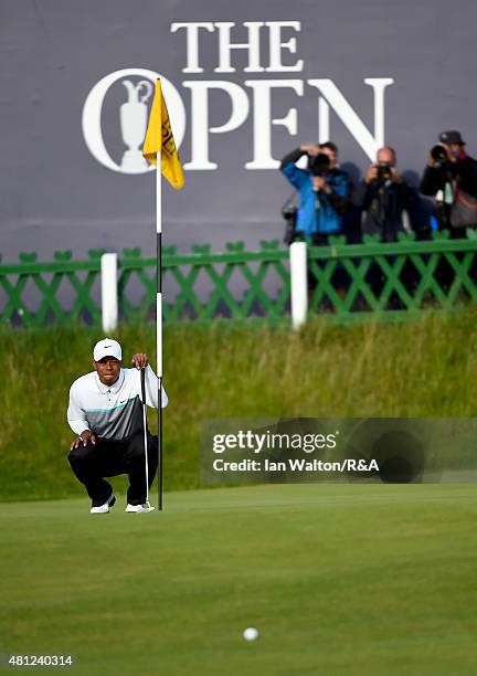 Tiger Woods of the United States lines up his putt on the 18th green during the second round of the 144th Open Championship at The Old Course on July...